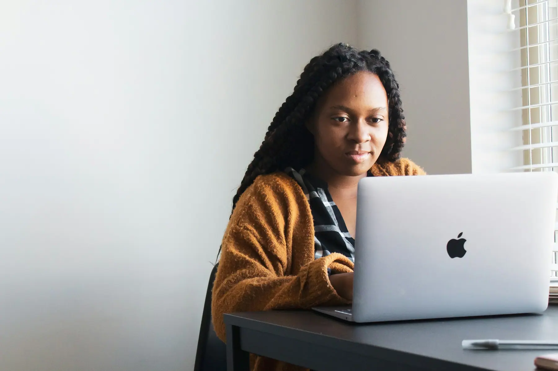 Business owner working comfortably at her laptop